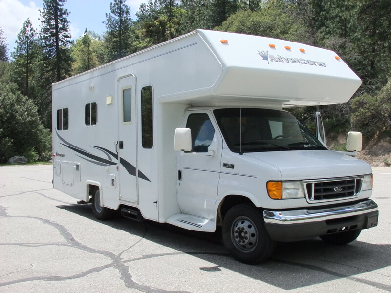 2012 Adventurer Class C motorhome on Ford chassis in mountain pines